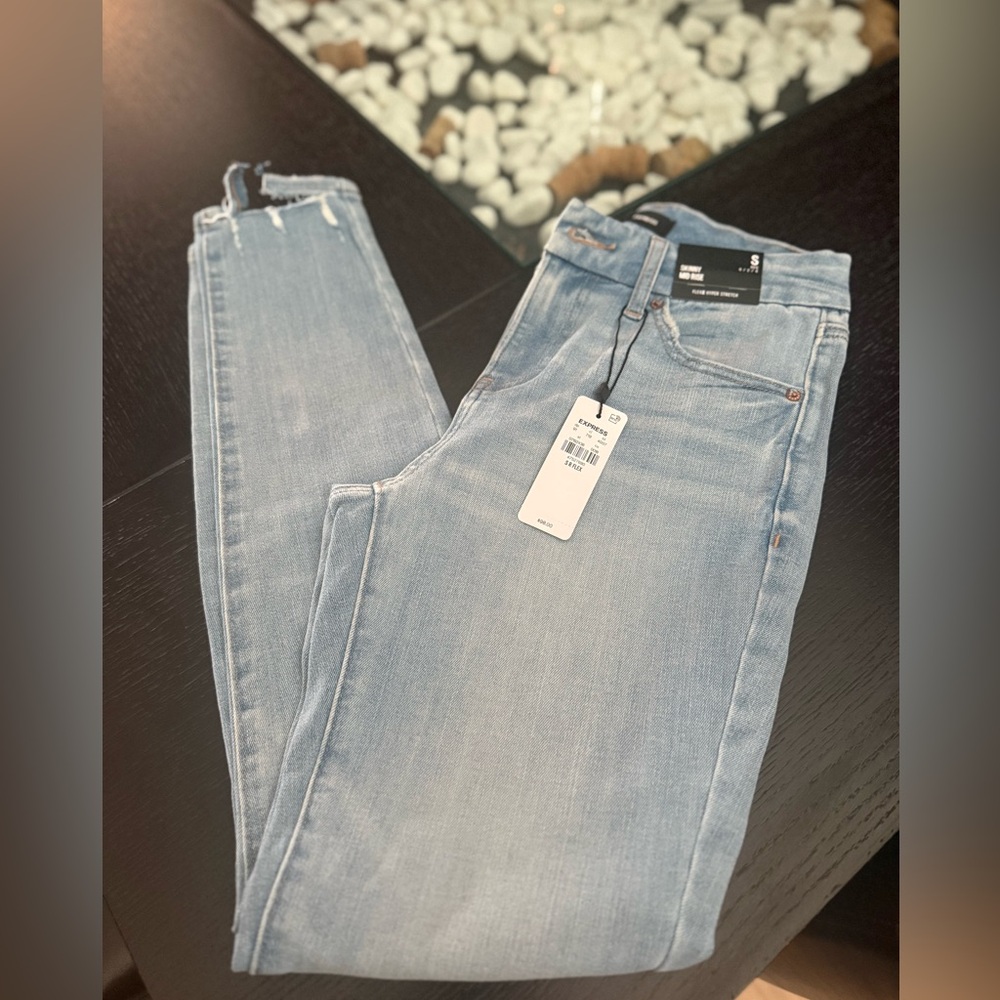 Express Mid Rise Light Wash FlexX Ripped
Skinny Jeans - Picture 3 of 7